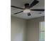 Bedroom features neutral paint, modern fan and a window at 175 Stoneview Cir, Covington, GA 30016