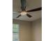 Bedroom features modern ceiling fan, neutral paint, and natural light from a window at 175 Stoneview Cir, Covington, GA 30016