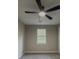 Bedroom features neutral paint, ceiling fan, carpet, and natural light from a window at 175 Stoneview Cir, Covington, GA 30016