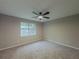 Bedroom features a ceiling fan and a bright window at 175 Stoneview Cir, Covington, GA 30016