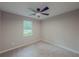 Cozy bedroom featuring a ceiling fan, plush carpet and a bright window at 175 Stoneview Cir, Covington, GA 30016