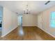 Bright dining area featuring hardwood floors and modern chandelier at 175 Stoneview Cir, Covington, GA 30016
