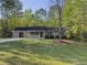 Charming single story home featuring a well manicured front yard and front porch at 175 Stoneview Cir, Covington, GA 30016