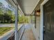 Covered front porch with views of the landscaped front yard and nearby street at 175 Stoneview Cir, Covington, GA 30016