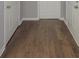 Hallway featuring hardwood floors and white trim at 175 Stoneview Cir, Covington, GA 30016