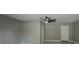 Spacious living area with neutral paint, modern ceiling fan and plush carpeting at 175 Stoneview Cir, Covington, GA 30016