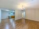 Open-concept living space with hardwood floors, open to the kitchen at 175 Stoneview Cir, Covington, GA 30016
