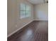 Living room featuring newly installed hardwood floors and a large window at 175 Stoneview Cir, Covington, GA 30016