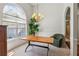 Bright dining room featuring a large window, a chandelier, and wainscoting details at 2265 Pemberton Pt, Buford, GA 30519