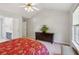 Spacious bedroom with en suite bathroom, large windows, and neutral decor at 2265 Pemberton Pt, Buford, GA 30519