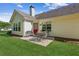 Charming patio with outdoor seating, a well-maintained lawn and view of the home's rear exterior at 2265 Pemberton Pt, Buford, GA 30519