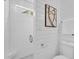 Modern bathroom with white subway tile shower and stylish fixtures and art at 2329 Wavetree Nw Ln, Acworth, GA 30101