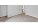 Cozy bedroom featuring neutral carpeting and a doorway leading to another room at 2329 Wavetree Nw Ln, Acworth, GA 30101
