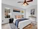 Comfortable bedroom boasts natural light, plush bedding, and stylish decor at 2329 Wavetree Nw Ln, Acworth, GA 30101