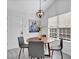Chic dining area featuring modern lighting, neutral wall art, and an inviting ambiance at 2329 Wavetree Nw Ln, Acworth, GA 30101