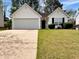 Charming single-story home with a well-manicured lawn, two-car garage, and inviting curb appeal at 2329 Wavetree Nw Ln, Acworth, GA 30101