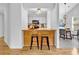 Bright kitchen showcasing seating bar with an open view of the dining room at 2329 Wavetree Nw Ln, Acworth, GA 30101