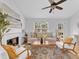 Beautiful living room features fireplace, stylish furniture, and plenty of natural light at 2329 Wavetree Nw Ln, Acworth, GA 30101
