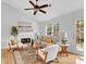 Inviting living room features vaulted ceiling, fireplace, and sliding door to outside at 2329 Wavetree Nw Ln, Acworth, GA 30101