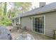 A view of the back deck featuring outdoor seating, a grill, and sliding glass doors to the house at 3805 Forsythia Way, Douglasville, GA 30135
