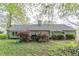 Back exterior showing a deck and lush foliage in the backyard at 3805 Forsythia Way, Douglasville, GA 30135
