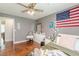 Bedroom with wood flooring and ceiling fan at 3805 Forsythia Way, Douglasville, GA 30135