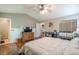 Bedroom with an ensuite bathroom, hardwood floors, a vaulted ceiling, and a sliding mirror closet at 3805 Forsythia Way, Douglasville, GA 30135