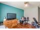 Bedroom with a teal accent wall and a ceiling fan at 3805 Forsythia Way, Douglasville, GA 30135