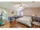 A primary bedroom featuring hardwood floors, a vaulted ceiling, and a sliding mirror closet at 3805 Forsythia Way, Douglasville, GA 30135