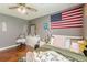Comfortable bedroom featuring a ceiling fan and wood flooring at 3805 Forsythia Way, Douglasville, GA 30135