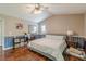 Bedroom featuring hardwood floors, a vaulted ceiling, a mirror closet and an ensuite bathroom at 3805 Forsythia Way, Douglasville, GA 30135