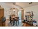 Cozy dining area features a ceiling fan, hardwood floors, and view to the backyard at 3805 Forsythia Way, Douglasville, GA 30135