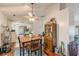 Functional dining area features a ceiling fan, hardwood floors, and view to kitchen at 3805 Forsythia Way, Douglasville, GA 30135