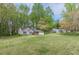Traditional home featuring a two-car garage, neat lawn, and shrubbery on the front porch at 3805 Forsythia Way, Douglasville, GA 30135