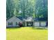 Charming single-story home with a well-manicured lawn, inviting front porch and two-car garage at 3805 Forsythia Way, Douglasville, GA 30135