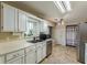 Functional kitchen features stainless steel appliances and plenty of natural light at 3805 Forsythia Way, Douglasville, GA 30135