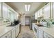 Traditional kitchen with white cabinets, stainless steel appliances, and tile backsplash at 3805 Forsythia Way, Douglasville, GA 30135