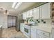 Classic kitchen with white cabinets, stainless appliances, and updated countertop at 3805 Forsythia Way, Douglasville, GA 30135