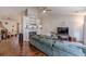 A bright living room featuring a fireplace, vaulted ceilings, and gleaming hardwood floors at 3805 Forsythia Way, Douglasville, GA 30135