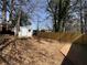 Wooded backyard with storage shed and privacy fence provides secluded retreat at 4049 Heritage Valley Ct, Norcross, GA 30093