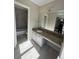 Elegant bathroom with modern vanity and granite countertops, complemented by stylish gray tile in the shower at 4049 Heritage Valley Ct, Norcross, GA 30093