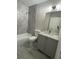 Modern bathroom with stylish shower tile, vanity, and fixtures at 4049 Heritage Valley Ct, Norcross, GA 30093