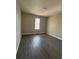 Inviting bedroom featuring hardwood style floors and natural light at 4049 Heritage Valley Ct, Norcross, GA 30093