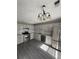 Charming kitchen featuring modern stainless appliances and white cabinetry with light countertops at 4049 Heritage Valley Ct, Norcross, GA 30093