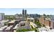 An aerial view showing the building's location in a vibrant, urban neighborhood with lush greenery at 860 Peachtree Ne St # 2118, Atlanta, GA 30308