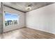 Cozy bedroom with hardwood floors and a large window offering city views at 860 Peachtree Ne St # 2118, Atlanta, GA 30308
