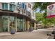Inviting building entrance with modern architectural details and decorative planters at 860 Peachtree Ne St # 2118, Atlanta, GA 30308