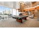 Game room featuring a pool table, comfortable seating, and city views for a luxurious and entertaining experience at 860 Peachtree Ne St # 2118, Atlanta, GA 30308