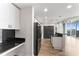 Open kitchen features sleek cabinetry, granite countertops, and stainless steel appliances at 860 Peachtree Ne St # 2118, Atlanta, GA 30308