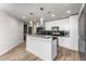 Modern kitchen featuring granite counters, black backsplash, and stainless steel appliances at 860 Peachtree Ne St # 2118, Atlanta, GA 30308